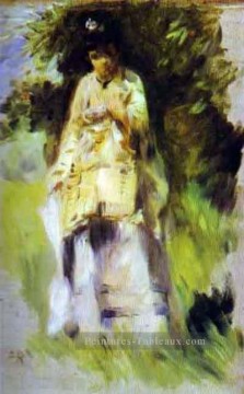  femme - femme debout près d’un arbre Pierre Auguste Renoir